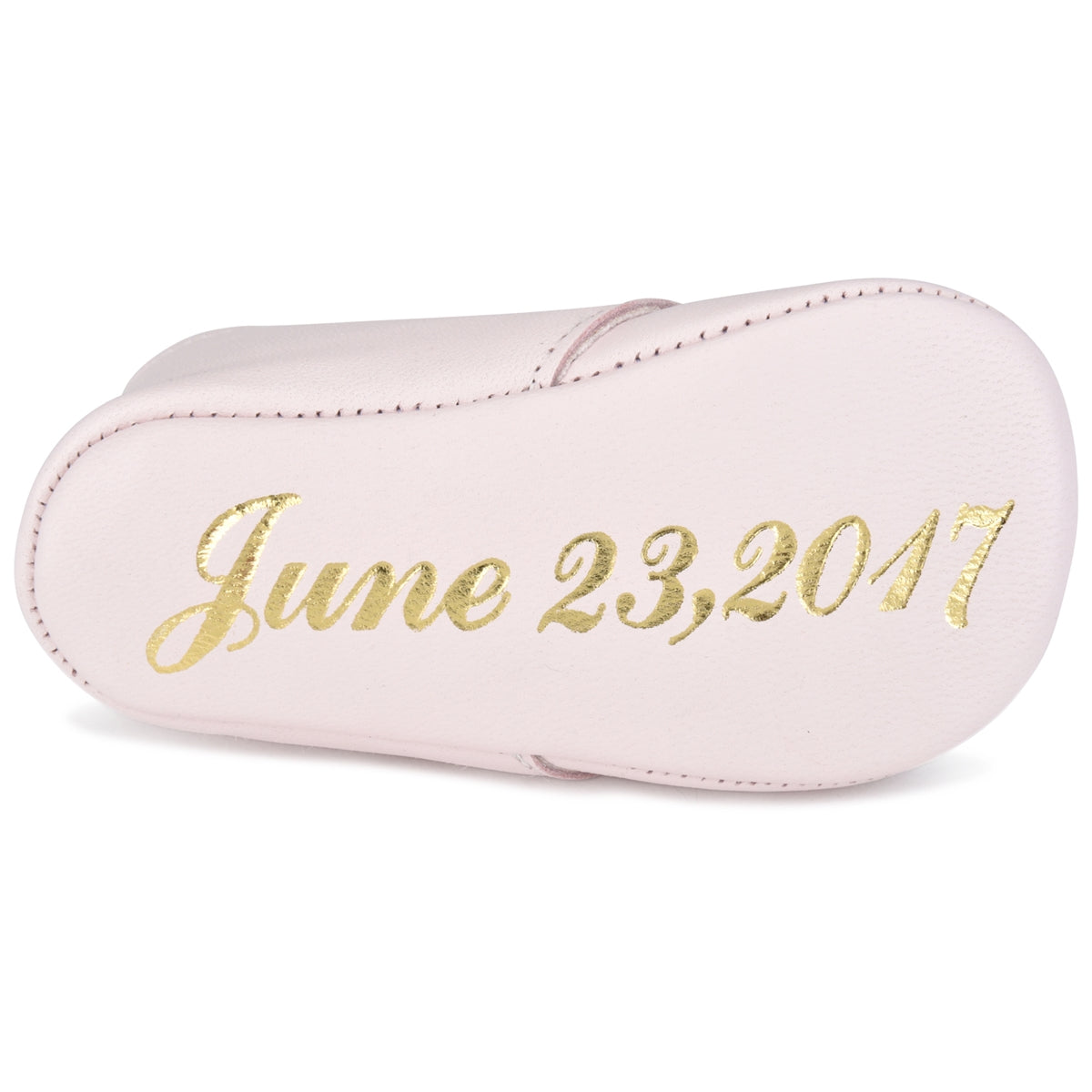 Baby shoes with store name on bottom